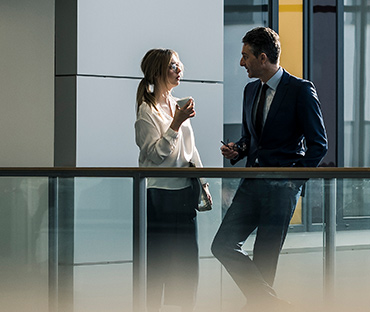 Businessman and businesswoman talking