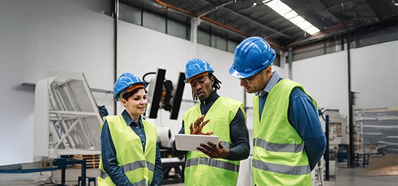 team of engineers working in robotic factory